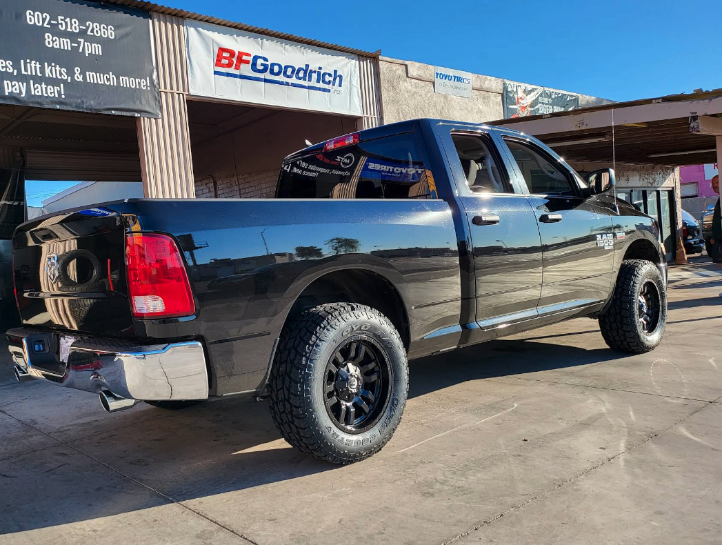 Lifted black Ram truck with custom wheels at MTZ Tires and Wheels